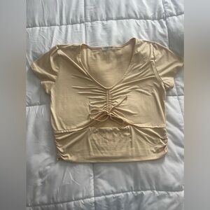 Light yellow crop top v neck with mid cut out section